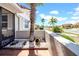 Charming front porch with decorative landscaping and a view of the peaceful neighborhood street at 1969 Wolf Laurel Dr, Sun City Center, FL 33573