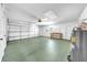 Spacious two car garage with garage door and plenty of room for storage at 1969 Wolf Laurel Dr, Sun City Center, FL 33573