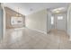 Spacious living room with a vaulted ceiling, tile floors, and natural light from the windows at 1969 Wolf Laurel Dr, Sun City Center, FL 33573