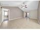 Spacious living area with tile flooring, and a sliding glass door to let in plenty of natural light at 1969 Wolf Laurel Dr, Sun City Center, FL 33573