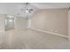 Open living room featuring tile floors, a ceiling fan, and ample natural light from windows at 1969 Wolf Laurel Dr, Sun City Center, FL 33573