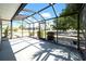 Enjoy this relaxing screened patio with view of the home's manicured yard and landscaped surroundings at 1969 Wolf Laurel Dr, Sun City Center, FL 33573
