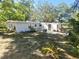 Spacious backyard with patio area and lush greenery, perfect for outdoor entertaining at 205 Park Ridge Ave, Temple Terrace, FL 33617