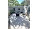 Inviting backyard patio with brick pavers, seating area, and privacy fence for relaxation at 205 Park Ridge Ave, Temple Terrace, FL 33617