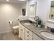 Elegant bathroom with double vanity, granite countertops, and stylish fixtures, combining functionality with modern design at 205 Park Ridge Ave, Temple Terrace, FL 33617