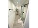 Bright bathroom with hardwood flooring, modern decor, and glass-enclosed shower at 205 Park Ridge Ave, Temple Terrace, FL 33617