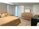 Well-lit bedroom featuring light wood floors, a crib, and closet space at 205 Park Ridge Ave, Temple Terrace, FL 33617
