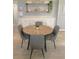 Inviting dining room featuring a round wooden table with gray chairs, ideal for gatherings and everyday meals at 205 Park Ridge Ave, Temple Terrace, FL 33617