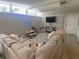 Spacious living room with large sectional sofa, providing ample seating and a relaxed atmosphere for Gathering and guests at 205 Park Ridge Ave, Temple Terrace, FL 33617