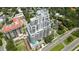 Aerial view of luxury building with pool, surrounding cityscape and verdant landscaping at 2103 Bayshore Blvd # 1701, Tampa, FL 33606