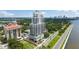 Scenic aerial of building with bay views, lush landscaping, and nearby roads at 2103 Bayshore Blvd # 1701, Tampa, FL 33606