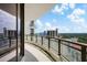 Spacious balcony with glass railings showcasing panoramic city views and beautiful skies at 2103 Bayshore Blvd # 1701, Tampa, FL 33606