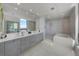 Spa-like bathroom with double sinks, a soaking tub, and a walk-in shower at 2103 Bayshore Blvd # 1701, Tampa, FL 33606