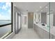 Spacious main bathroom boasts double vanities, bright lighting, and elegant fixtures at 2103 Bayshore Blvd # 1701, Tampa, FL 33606