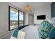 Bedroom featuring a city view from a private balcony and modern finishes at 2103 Bayshore Blvd # 1701, Tampa, FL 33606