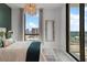 Bright bedroom with a chandelier, large windows with views, and modern decor at 2103 Bayshore Blvd # 1701, Tampa, FL 33606