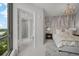 Bedroom with attached bathroom, large windows, and modern decor at 2103 Bayshore Blvd # 1701, Tampa, FL 33606