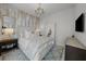 Well-lit bedroom featuring a large bed, modern decor, and city views at 2103 Bayshore Blvd # 1701, Tampa, FL 33606