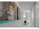 Hallway with art leading to a bedroom with lots of natural light at 2103 Bayshore Blvd # 1701, Tampa, FL 33606