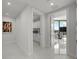 Hallway view, with modern tile flooring, that shows a kitchenette and sitting room at 2103 Bayshore Blvd # 1701, Tampa, FL 33606