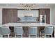 Bright kitchen with stone backsplash, modern appliances, quartz countertops and island with seating at 2103 Bayshore Blvd # 1701, Tampa, FL 33606