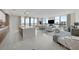 Open-concept living room with a large island, modern lighting, and floor-to-ceiling windows with a view at 2103 Bayshore Blvd # 1701, Tampa, FL 33606