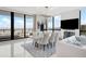 Open-concept living room with tile floors, modern lighting, and a view of the water at 2103 Bayshore Blvd # 1701, Tampa, FL 33606