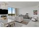 Well-lit living room and dining area featuring modern décor, beautiful views and tile flooring at 2103 Bayshore Blvd # 1701, Tampa, FL 33606