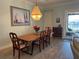 Elegant dining room with wood table, chandelier, and view to patio at 2217 5Th E St, Palmetto, FL 34221