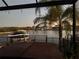 Enjoy the water views from the covered patio with a boat, dock, and the neighborhood across the canal at 2217 5Th E St, Palmetto, FL 34221