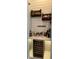 Chic wine bar area with a wine cooler, custom shelving, and stylish decor, perfect for entertaining at 2217 5Th E St, Palmetto, FL 34221