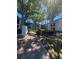 Condominium complex with mature trees and walking path, showcasing a peaceful community at 2971 Estancia Blvd # 225, Clearwater, FL 33761