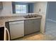 Well-maintained kitchen with stainless steel sink and white appliances, great granite countertops at 2971 Estancia Blvd # 225, Clearwater, FL 33761