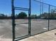 Tennis court in a fenced-in area, perfect for recreational activities and exercise at 2971 Estancia Blvd # 225, Clearwater, FL 33761