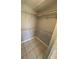 Walk-in closet with vinyl flooring and wire shelving for ample storage space at 2971 Estancia Blvd # 225, Clearwater, FL 33761