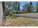 Spacious backyard featuring a white privacy fence and beautiful landscaping at 3004 Rolling Acres Pl, Valrico, FL 33596