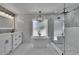 Modern bathroom with a standalone tub, glass shower, double vanity, and stylish light fixtures at 3004 Rolling Acres Pl, Valrico, FL 33596