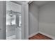 Bright bathroom boasts a modern tub, a decorative light fixture, and a glass-enclosed shower at 3004 Rolling Acres Pl, Valrico, FL 33596