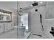 Bathroom featuring standalone tub, glass enclosed shower, double vanity, and modern fixtures at 3004 Rolling Acres Pl, Valrico, FL 33596