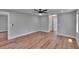 Large bedroom features hardwood floors, recessed lights, ceiling fan, and walk in closet at 3004 Rolling Acres Pl, Valrico, FL 33596