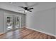 Bedroom featuring wood-look flooring, light gray walls, and French doors at 3004 Rolling Acres Pl, Valrico, FL 33596