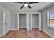Inviting bedroom with hardwood floors and open closet space at 3004 Rolling Acres Pl, Valrico, FL 33596