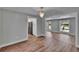Bright dining room featuring hardwood floors, elegant chandelier, and an open floor plan at 3004 Rolling Acres Pl, Valrico, FL 33596