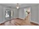 Bright dining room with stylish lighting and view into living area and to the patio at 3004 Rolling Acres Pl, Valrico, FL 33596