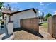 Exterior side view featuring a privacy fence, pristine landscaping and well-kept yard at 3004 Rolling Acres Pl, Valrico, FL 33596