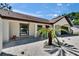 Well-maintained, single-story home with manicured landscaping, featuring a white brick facade at 3004 Rolling Acres Pl, Valrico, FL 33596