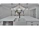 Kitchen featuring a large island, farmhouse sink, and modern lighting at 3004 Rolling Acres Pl, Valrico, FL 33596