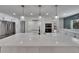 Kitchen with a large island, stainless steel appliances, and brick accents at 3004 Rolling Acres Pl, Valrico, FL 33596
