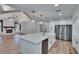 Kitchen featuring island, stainless steel appliances, and modern lighting at 3004 Rolling Acres Pl, Valrico, FL 33596