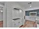Updated kitchen with brick archway, stainless appliances, and ample counter space at 3004 Rolling Acres Pl, Valrico, FL 33596